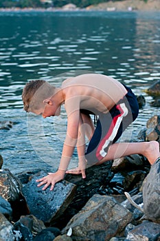 Boy on a background of sea and mountains