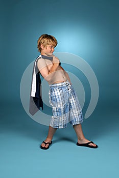 Boy in baggy blue plaid shorts
