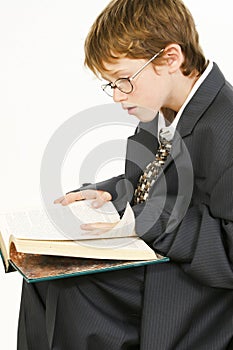 Boy in Baggy Suit Reading