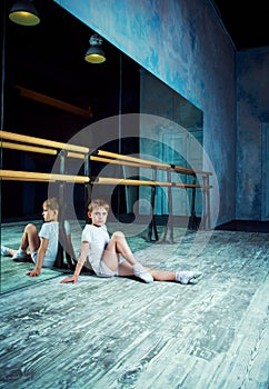 Boy ballet dancer doing exercise at dance class