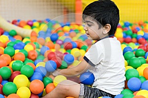 Boy in balls pool