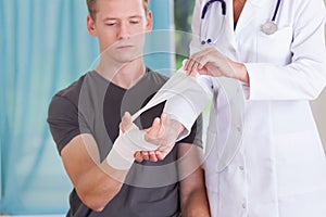 Boy with bandaged hand photo