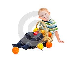 Boy with basket full of fresh fruit