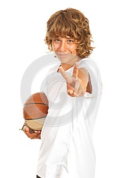 Boy with basketball showing victory