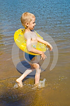 Boy bathes in the river
