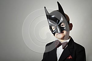 Boy in Batman Mask. Funny Child in Black Suit