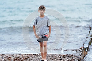 Boy on the beach. Family vacation by the sea. Active lifestyle