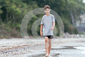 Boy on the beach. Family vacation by the sea. Active lifestyle