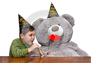 Boy and bear with party favors