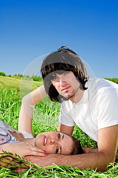 Boy and beautiful girl on grass