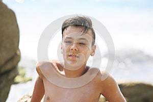 Boy with beautiful green eyes looking at the camera