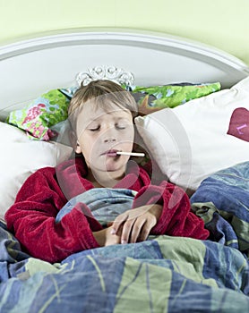 Boy in bed with fever