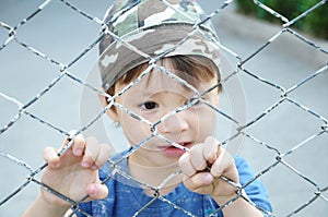 Boy behind bars