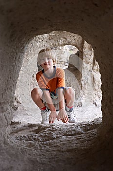 Boy behind tunnel