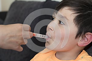 Boy Being Given Medicine via Syringe