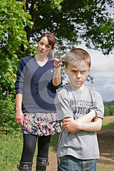 Boy being told off by his mum