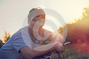 Boy in a bicycle outdoors