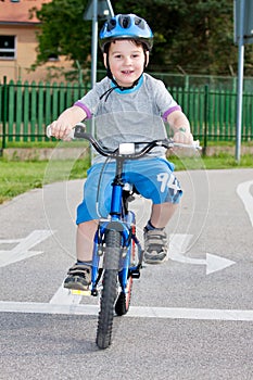 Boy on bicycling photo