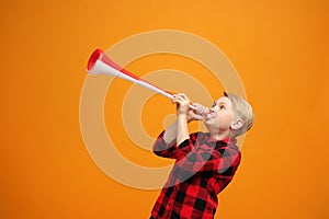 Boy with a big fan trumpet.