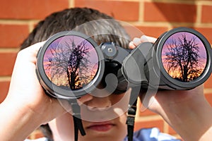 Boy with binoculars