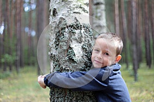 Boy and birch tree