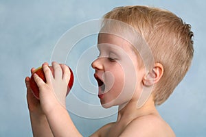 Boy Biting an Apple - Anticipation photo