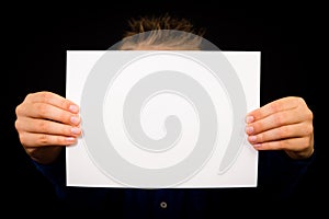 Boy with blank white sign