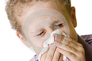 Boy blow nose closed eyes