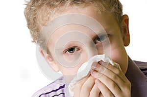 Boy blow nose open eyes