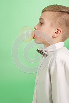Boy blowing a bubblegum bubble