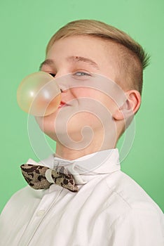 Boy blowing a bubblegum bubble