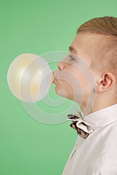 Boy blowing a bubblegum bubble