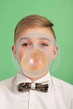 Boy blowing a bubblegum bubble