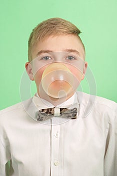Boy blowing a bubblegum bubble