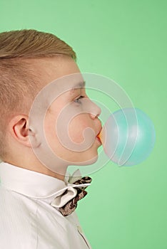 Boy blowing a bubblegum bubble