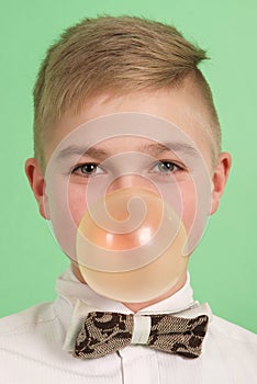 Boy blowing a bubblegum bubble