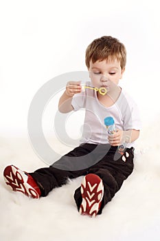 Boy blowing bubbles