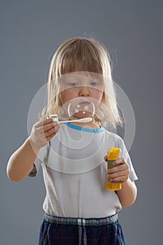 Boy blowing bubbles