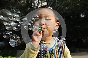 A boy blowing bubbles