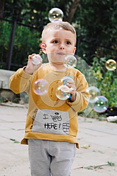 Boy blowing bubbles