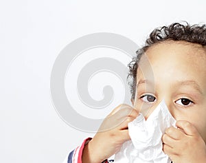 Boy blowing nose stock photo