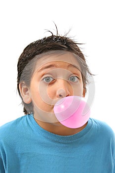 Boy blowing a pink bubble gum