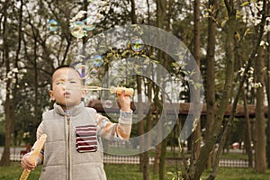 Boy blowing soapbubbles