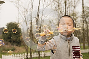 Boy blowing soapbubbles