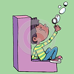 boy blows soap bubbles while sitting on the letter L
