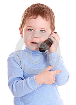 Boy in blue speak on phone.