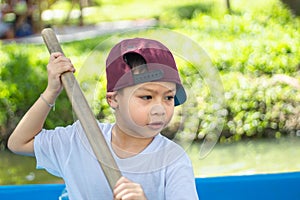 The boy boating in the park.