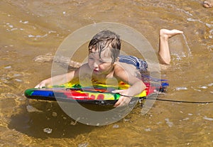 Boy with a bodyboard.