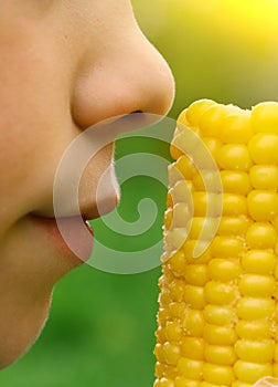 Boy with boiled gold corn