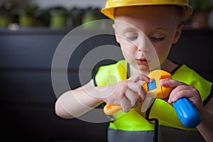 Boy with a Boss builder helmet